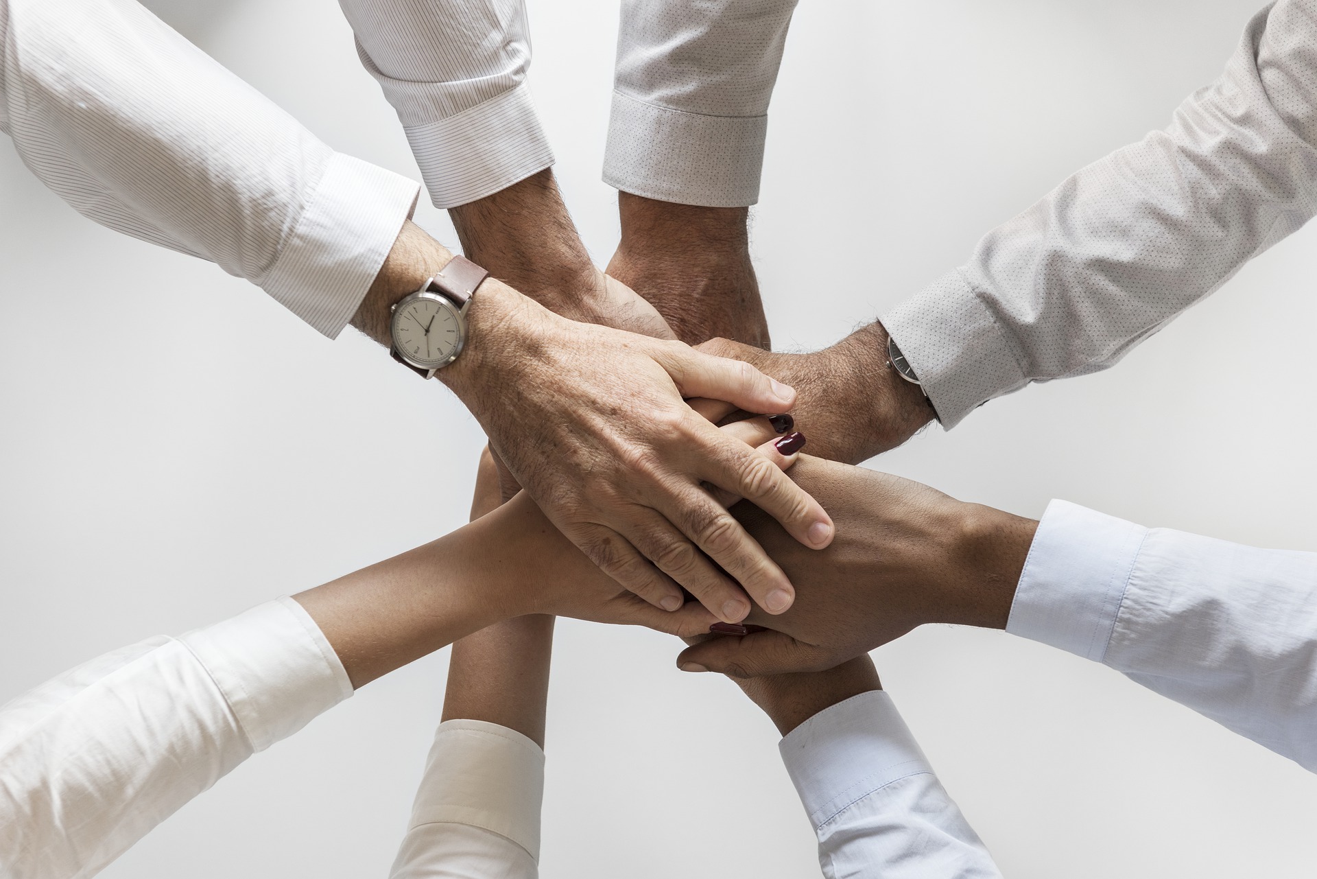 Group of hands clasped as a team