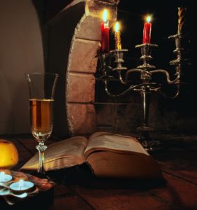 Wine glass with book, candles, wall bracket